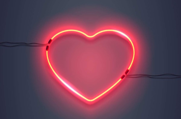 A neon light in the shape of a heart